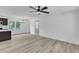 Spacious living room with wood flooring leads to the kitchen and dining area at 460 Bunn Elementary School Rd, Bunn, NC 27508