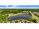 Aerial view showcasing the neighborhood's lake, lush greenery, and well-spaced homes at 479 Manchester Trail, Clayton, NC 27527