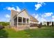 Home featuring a backyard with a screened-in porch and a wood deck at 479 Manchester Trail, Clayton, NC 27527
