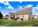 A house with a cozy backyard with a wooden fence, deck, and grill at 479 Manchester Trail, Clayton, NC 27527