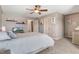 Cozy bedroom featuring neutral carpet, ceiling fan, and ample natural light at 479 Manchester Trail, Clayton, NC 27527
