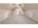 Large bonus room with neutral carpet, vaulted ceilings, and a ceiling fan at 479 Manchester Trail, Clayton, NC 27527