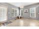 Cozy breakfast nook with lots of natural light, a modern light fixture, and stylish decor at 479 Manchester Trail, Clayton, NC 27527