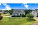Charming two-story home with a well-manicured lawn and inviting curb appeal at 479 Manchester Trail, Clayton, NC 27527