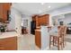 Bright kitchen with breakfast bar, wooden cabinets, and modern appliances at 479 Manchester Trail, Clayton, NC 27527