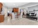 Spacious kitchen open to the living room with bar seating and granite countertops at 479 Manchester Trail, Clayton, NC 27527