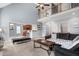 Bright living room open to the kitchen with plenty of seating and natural light at 479 Manchester Trail, Clayton, NC 27527