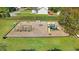 Community playground with swings, slides, and climbing structures in a secure, grassy area at 479 Manchester Trail, Clayton, NC 27527