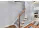 Carpeted staircase with wood trim and handrail, leading to the upper level of the home at 479 Manchester Trail, Clayton, NC 27527