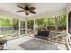 Relaxing screened porch with comfortable seating, providing a serene outdoor living space at 4808 Berini Dr, Durham, NC 27705