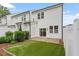 View of fenced backyard with manicured grass, patio and view of siding at 520 Kenton Mill Ct, Rolesville, NC 27571