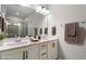 Bathroom with double sink vanity, decorative mirrors, and modern fixtures at 520 Kenton Mill Ct, Rolesville, NC 27571