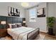 Bedroom with industrial style decor, large window and ample natural light at 520 Kenton Mill Ct, Rolesville, NC 27571