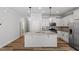 Kitchen with granite countertops, stainless steel appliances and sleek white cabinets at 520 Kenton Mill Ct, Rolesville, NC 27571