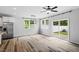 Bright living space with wood-look flooring, backyard access, and stainless steel refrigerator at 520 Kenton Mill Ct, Rolesville, NC 27571