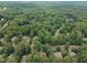 An aerial view shows the neighborhood's verdant tree canopy and the surrounding community at 522 N Scotswood Blvd, Hillsborough, NC 27278