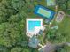Overhead view of a pool and clubhouse in a lush green community offering recreation and relaxation at 522 N Scotswood Blvd, Hillsborough, NC 27278
