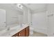 Neutral bathroom with double sinks, light fixtures, and a bathtub at 522 N Scotswood Blvd, Hillsborough, NC 27278