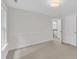 A bright bedroom features neutral carpet, fresh paint, and a view of the staircase at 522 N Scotswood Blvd, Hillsborough, NC 27278