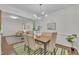 This dining room features a contemporary light fixture, seating for 6, and lots of natural light at 522 N Scotswood Blvd, Hillsborough, NC 27278