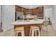 This kitchen features a central island, stainless steel appliances, and dark wood cabinetry at 522 N Scotswood Blvd, Hillsborough, NC 27278