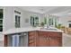 This kitchen features stainless steel appliances, and a view to the living room and backyard at 522 N Scotswood Blvd, Hillsborough, NC 27278