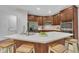 This kitchen features a central island, stainless steel appliances, and dark wood cabinetry at 522 N Scotswood Blvd, Hillsborough, NC 27278