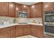 This kitchen features stainless steel appliances, white countertops and dark wood cabinetry at 522 N Scotswood Blvd, Hillsborough, NC 27278