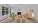 Bright living room with fireplace and large windows bringing in natural light at 522 N Scotswood Blvd, Hillsborough, NC 27278