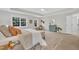 Inviting main bedroom with natural light, decorative wall art, and a cozy bench at the end of the bed at 522 N Scotswood Blvd, Hillsborough, NC 27278