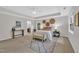 Spacious main bedroom featuring neutral tones, decorative woven wall art, and a cozy bench at 522 N Scotswood Blvd, Hillsborough, NC 27278