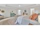 Comfortable main bedroom showcasing a stylish bed with accent pillows and a decorative dresser at 522 N Scotswood Blvd, Hillsborough, NC 27278