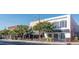Street view of shops with outdoor tables and awnings creating a welcoming atmosphere at 522 N Scotswood Blvd, Hillsborough, NC 27278