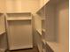Walk in closet with open shelving providing ample storage space for organizing your wardrobe at 55 Leah Ln, Louisburg, NC 27549