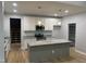 Bright kitchen with stainless steel appliances, granite countertops, and a large center island at 55 Leah Ln, Louisburg, NC 27549