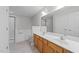 Double sink vanity, a walk-in shower, and a tub create a spa-like bathroom at 5506 Cottonrose Ln, Raleigh, NC 27606