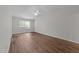 Spacious bedroom with hardwood floors and a ceiling fan at 5506 Cottonrose Ln, Raleigh, NC 27606