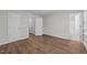 This bedroom has lots of storage and features wood-look vinyl flooring at 5506 Cottonrose Ln, Raleigh, NC 27606