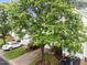 Overhead view of townhouses, showcasing their well-maintained lawns and convenient parking areas at 5506 Cottonrose Ln, Raleigh, NC 27606