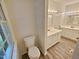 Bathroom featuring dual sink vanity, tile floor, and a framed window allowing for natural light at 5614 Skyline Dr, Durham, NC 27712