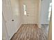 Inviting entryway featuring wood-look flooring and a classic white front door at 5614 Skyline Dr, Durham, NC 27712