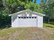 Detached white garage offering ample space for parking and storage at 5614 Skyline Dr, Durham, NC 27712