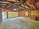 Spacious garage with concrete floor, shelving, and ample workspace at 5614 Skyline Dr, Durham, NC 27712