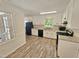 Updated kitchen with white cabinets, granite countertops, and black appliances at 5614 Skyline Dr, Durham, NC 27712