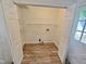 Functional laundry room with storage shelves and easy access to utilities at 5614 Skyline Dr, Durham, NC 27712