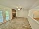 Cozy living room with a brick fireplace, modern flooring, and natural light at 5614 Skyline Dr, Durham, NC 27712