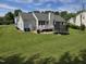 Expansive backyard with a deck, open lawn and trampoline at 5810 Stardust Ct, Durham, NC 27712