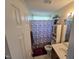 Bathroom featuring a shower with patterned curtain, toilet, and vanity at 5810 Stardust Ct, Durham, NC 27712