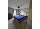 Bedroom with a ceiling fan, window with curtains, and framed pictures on the wall at 5810 Stardust Ct, Durham, NC 27712