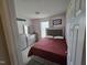 Comfortable bedroom with a silver framed bed, dresser, and bright natural light at 5810 Stardust Ct, Durham, NC 27712